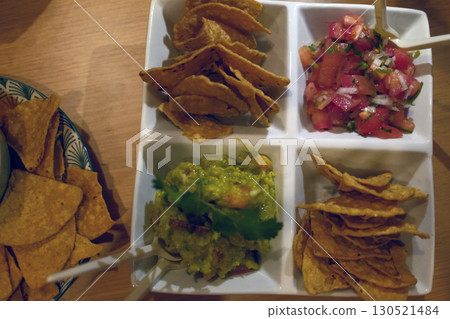 mexican food with tacos guacamole and nachos 130521484