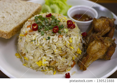 Fried Rice With Egg And Fried Chicken On Plate Fried Rice With Egg And Fried Chicken On Plate 130521888