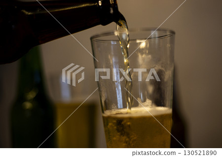 Pouring Cold Beer Into Glass 130521890