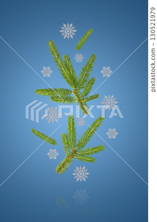 Christmas background of green trees and white snowflakes flying in the air on a blue background. Holiday card for New Year and Christmas 130521979