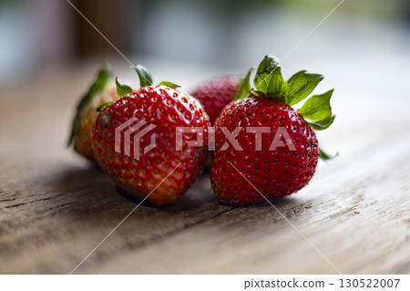 Fresh Strawberry Resting On Wooden Table Fresh Strawberry Resting On Wooden Table 130522007