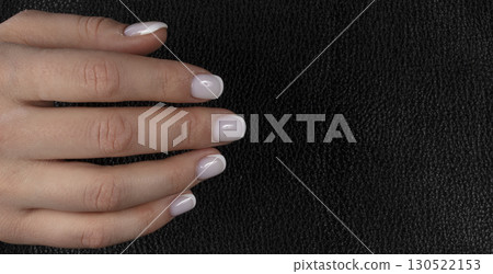 Classic white manicure on a dark background. Classic white manicure on a dark background. 130522153