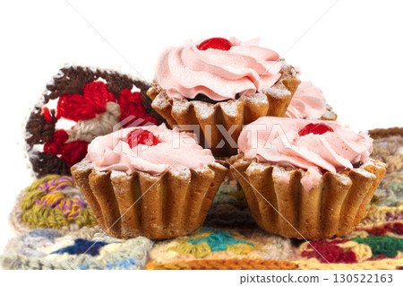 Beautiful sweets. Cakes basket with pink cream decorated with red berries. 130522163