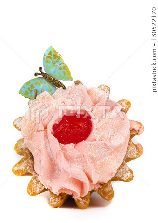 Cakes with protein cream decorated with a butterfly on a white plate. A beautiful sweet dessert. Cakes with protein cream decorated with a butterfly on a white plate. A beautiful sweet dessert. 130522170