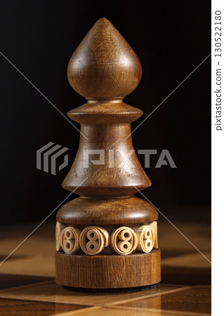 Chess wooden elephant. A puzzle game with tricky combinations that requires planning and thinking. Chess wooden elephant. A puzzle game with tricky combinations that requires planning and thinking. 130522180