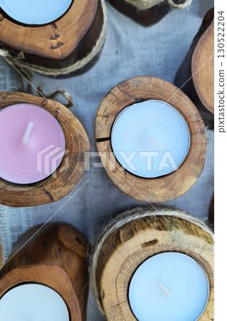 Colored interior candles in a wooden edging. 130522204