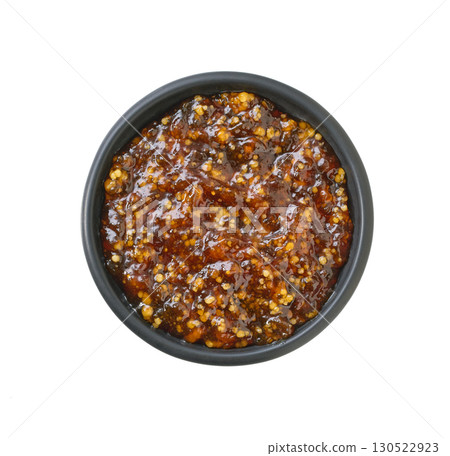 figs jam in a black bowl isolated on white background. Top view. 130522923