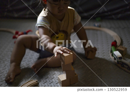 Toddler With His Toys, Playful toddler with a variety of toys, suited for family lifestyle videos or social media. 130522959