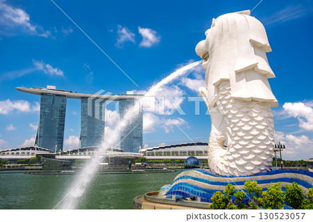 Singapore Merlion statue and Marina Bay Sands against the blue sky 130523057