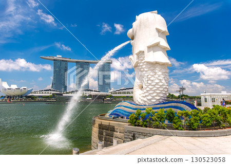 Singapore Merlion statue and Marina Bay Sands against the blue sky Singapore Merlion statue and Marina Bay Sands against the blue sky 130523058