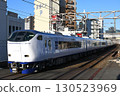 281 Series Limited Express Haruka (logo-wrapped car commemorating the 30th anniversary of Haruka service) heading through Osaka city towards Kansai Airport 130523969