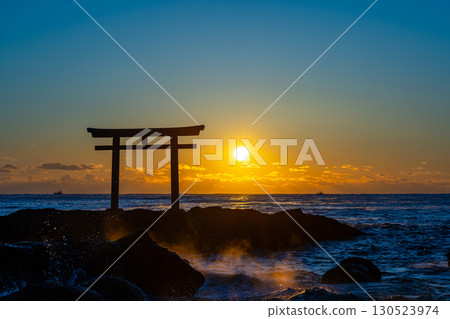 Torii gate floating in the sea and sunrise Torii gate floating in the sea and sunrise 130523974