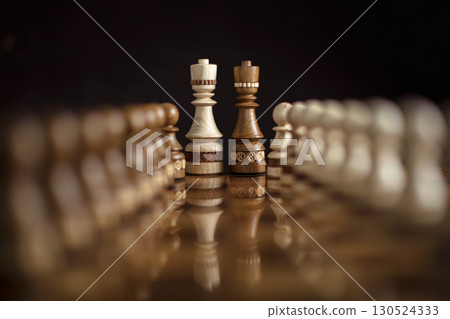 Chess on a dark background. A puzzle game with tricky combinations that requires planning and thinking. 130524333