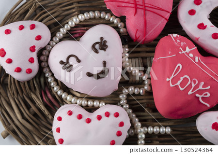 Beautiful pink gingerbread or heart shaped cookies. Sweet edible valentine's day gift. Beautiful pink gingerbread or heart shaped cookies. Sweet edible valentine's day gift. 130524364