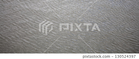 Gray water texture. Water in a river or lake. Gray water texture. Water in a river or lake. 130524397