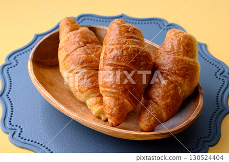 Croissants served on a plate for breakfast 130524404