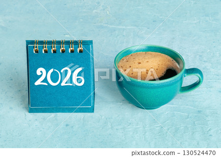 2026 Calendar. A desk calendar for the next year, shot on a blue background 2026 Calendar. A desk calendar for the next year, shot on a blue background 130524470
