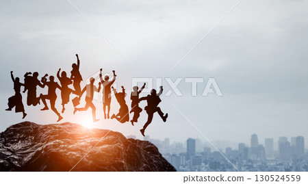 Silhouettes of people of various attributes jumping against the backdrop of the city Silhouettes of people of various attributes jumping against the backdrop of the city 130524559