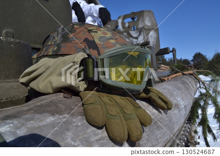 Military helmet on the tank of the war Military helmet on the tank of the war 130524687