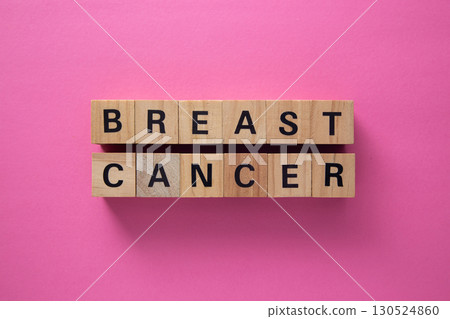 Breast cancer awareness message on wooden cubes on pink background 130524860