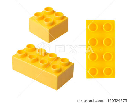 Yellow plastic building blocks isolated on white background 130524875