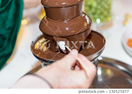 Vibrant chocolate fountain Vibrant chocolate fountain 130525877