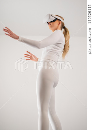 Woman Interacting With Virtual Reality Woman Interacting With Virtual Reality 130526115