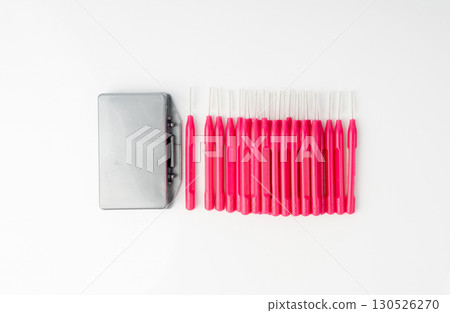 Orthodontic wax box and interdental brushes top view. Dental hygiene set 130526270