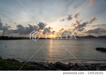 Sunset view from La Digue with silhouette of Praslin Island 130526281