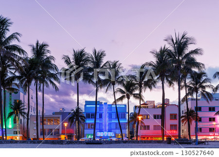 Colorful Art Deco hotels on Ocean Drive in Miami Beach glow under the warm hues of a vibrant sunset Colorful Art Deco hotels on Ocean Drive in Miami Beach glow under the warm hues of a vibrant sunset 130527640