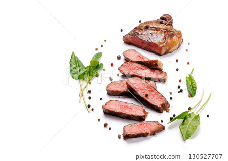 A perfectly cooked sliced striploin steak with a juicy, tender texture 130527707