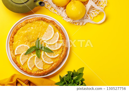 Delicious lemon tart with golden crust and smooth, glossy lemon filling 130527756