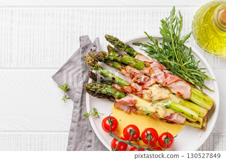 Grilled asparagus with bacon and egg sauce Grilled asparagus with bacon and egg sauce 130527849