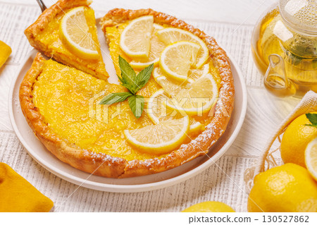 Delicious lemon tart with golden crust and smooth, glossy lemon filling Delicious lemon tart with golden crust and smooth, glossy lemon filling 130527862
