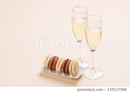 Pairing of champagne and delicate macaroons Pairing of champagne and delicate macaroons 130527996