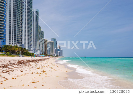 Modern skyline of Miami with towering skyscrapers, tropical vibe, and waterfront views 130528035