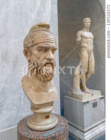 VATICAN CITY, ROME, ITALY - AUGUST 02, 2025 Classical marble bust sculpture of a bearded Dacian man wearing typical pointed Phrygian cap VATICAN CITY, ROME, ITALY - AUGUST 02, 2025 Classical marble bust sculpture of a bearded Dacian man wearing typical pointed Phrygian cap 130528372