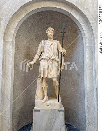 VATICAN CITY, ROME, ITALY - AUGUST 02, 2025 Classical marble statue of a hunter located in the Chiaramonti Museum, Braccio Nuovo (New Wing) 130528374