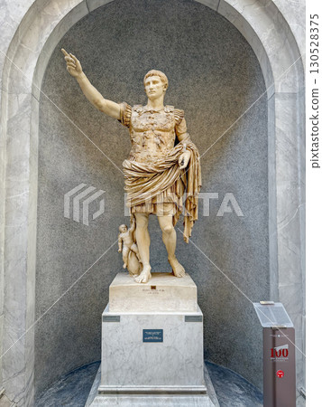 VATICAN CITY, ROME, ITALY - AUGUST 02, 2025 Classical marble statue of Rome's first emperor, Augustus of prima porta in military attire, located in the Chiaramonti Museum, Braccio Nuovo (New Wing) 130528375
