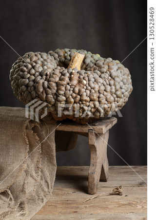 Marina Di Chioggia Pumpkin On Rustic Wooden Stool Marina Di Chioggia Pumpkin On Rustic Wooden Stool 130528469