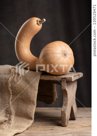 Canada Crookneck Squash Pumpkin On Rustic Wooden Stool 130528471