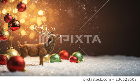 Christmas scene with a reindeer figurine in the snow, surrounded by ornaments and glowing bokeh lights. 130528502