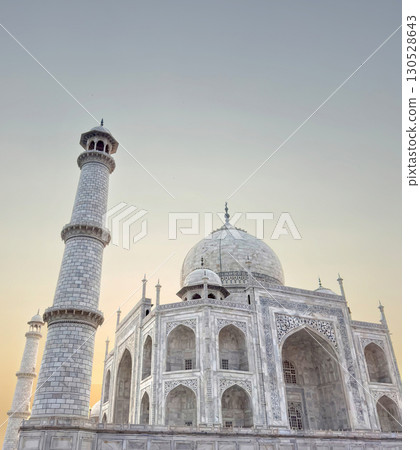 Taj Mahal in Agra, India. Indian marble mausoleum with ornate inlay, intricate carvings, arches, Taj Mahal in Agra, India. Indian marble mausoleum with ornate inlay, intricate carvings, arches, 130528643