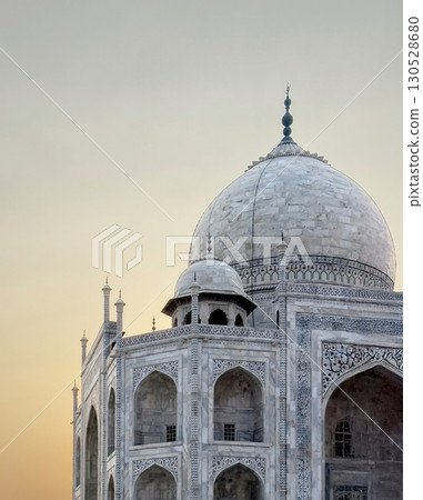 Taj Mahal in Agra, India. Iconic white marble mausoleum with ornate inlay, intricate carvings, Taj Mahal in Agra, India. Iconic white marble mausoleum with ornate inlay, intricate carvings, 130528680