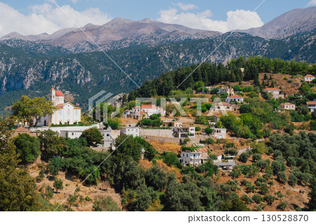 Church and chapel of Agios Mamas in Lakkoi village in Crete mountains on sunny day. 130528870