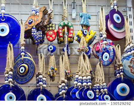 Traditional evil eye amulets displayed in a shop. Belief, culture, and protection through decorative ornaments. 130529292