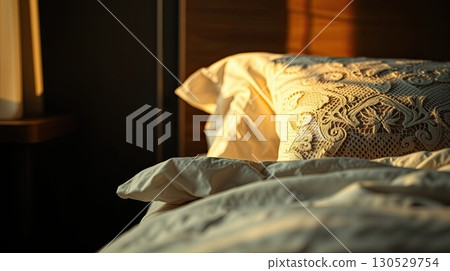 Bedroom with textured bedding and ambient lighting. Bedroom with textured bedding and ambient lighting. 130529754