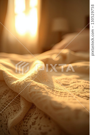 Comfortable textile bedding in softly lit bedroom. Comfortable textile bedding in softly lit bedroom. 130529758