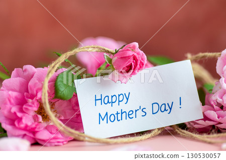 Beautiful bouquet of roses and a thank you note for a gift 130530057