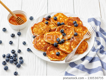 fried hot and crispy pancakes with blueberries fried hot and crispy pancakes with blueberries 130530735